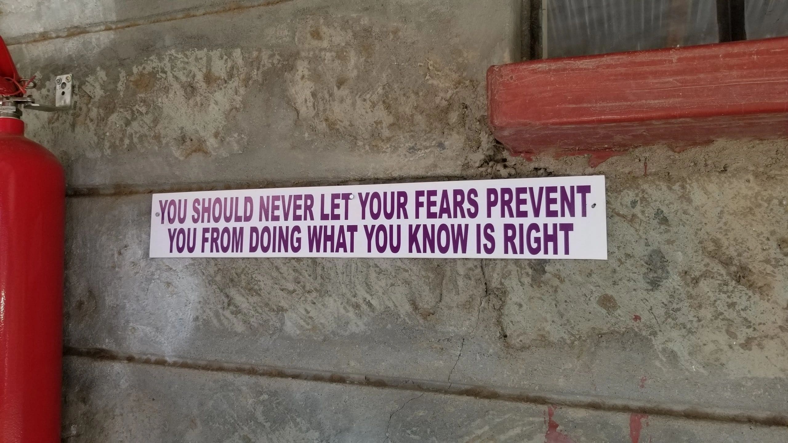 Sign advising not to let fears stop doing what's right.
