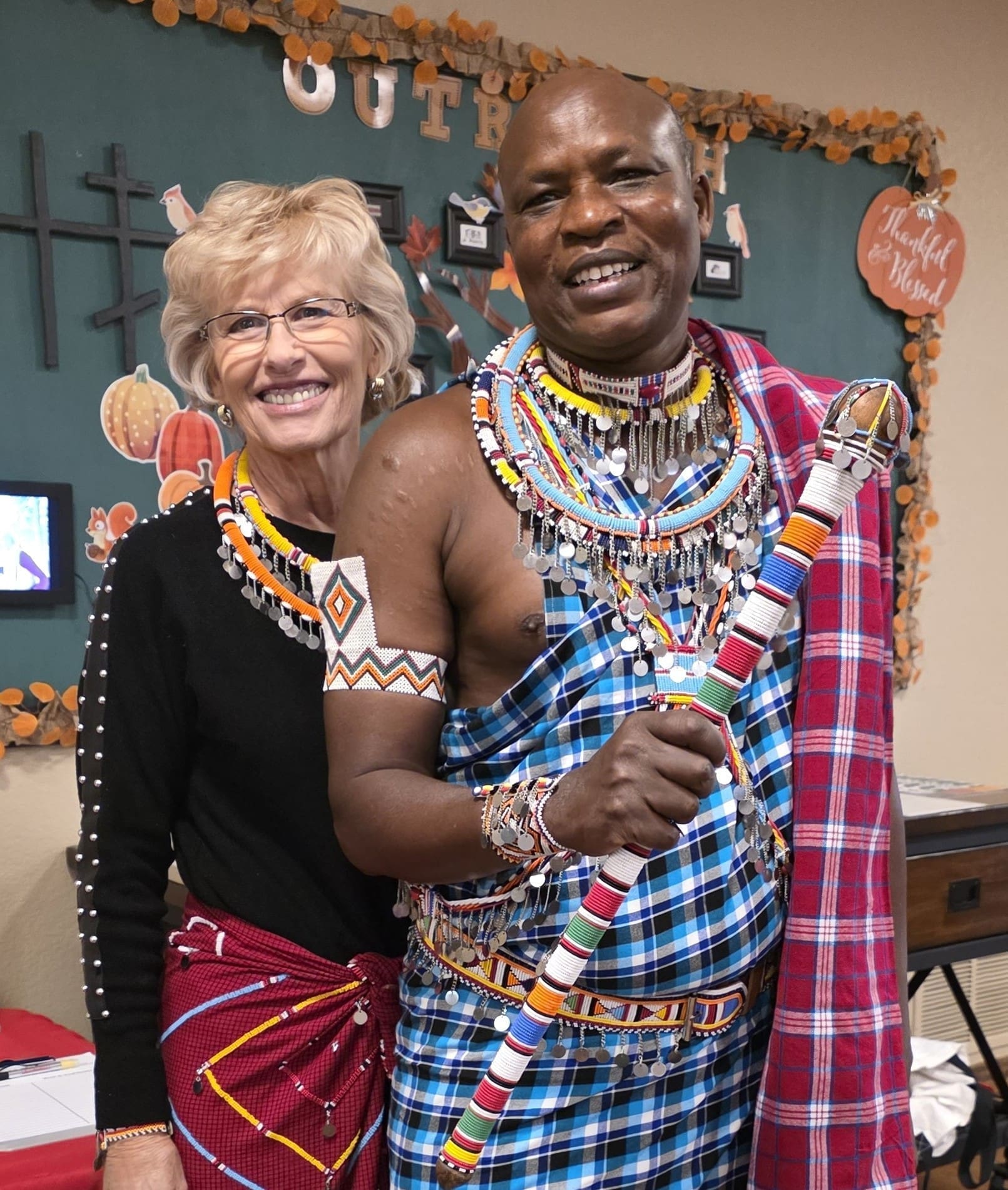 Smiling couple in colorful traditional beaded attire